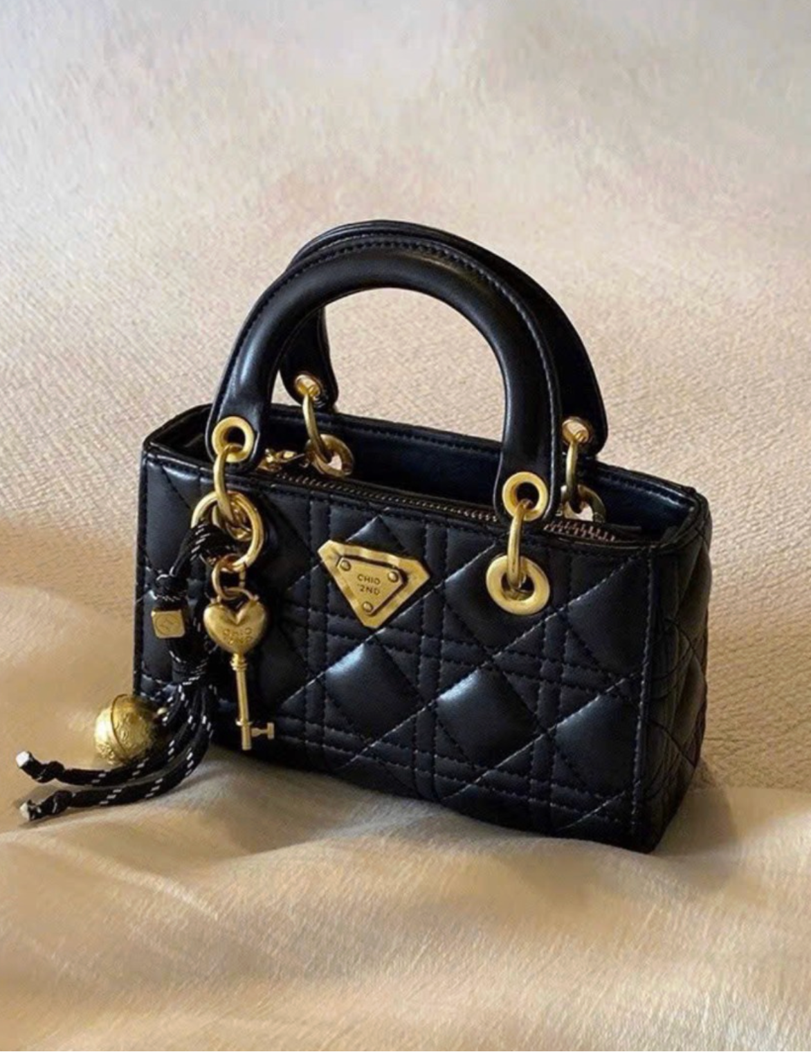 The Signature Lock Handbag